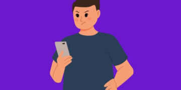 Ilustração de um homem com expressão irritada, olhando para o smartphone. Overposting